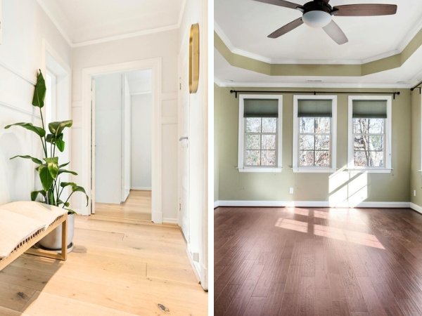 Light hardwood floors in a small hallway and dark hardwood flooring in a large open room